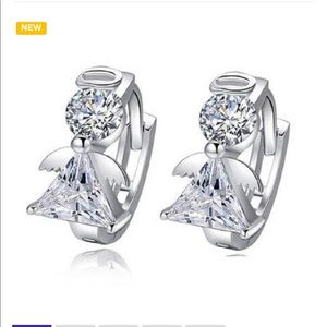 Genuine white gold plated Huggie earrings.